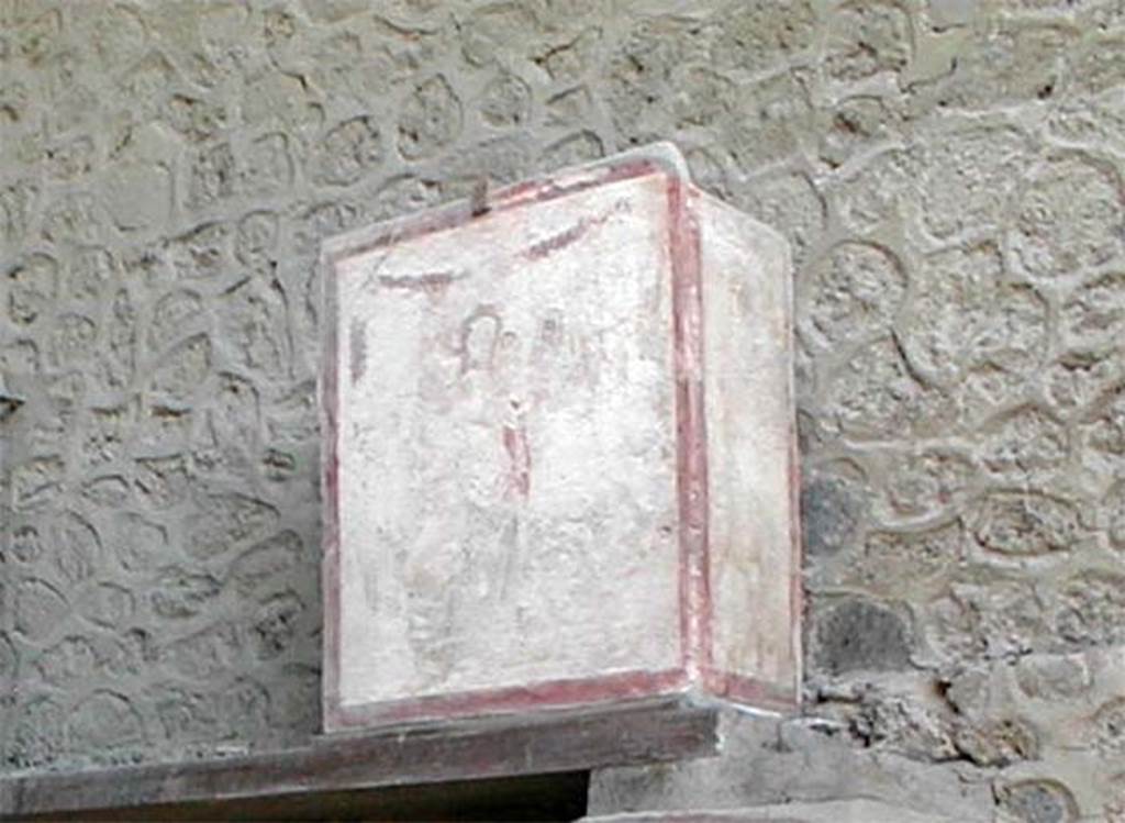 II.1.12 Pompeii. May 2005. Pilaster painting from north side of entrance façade.
Painting of Venus Anadyomene (Venus rising from the sea) with a small naked Eros and a jumping dolphin. This was in III.3.6. 
See Fröhlich, T., 1991, Lararien und Fassadenbilder in den Vesuvstädten. Mainz: von Zabern. (F16: p.312, T. 54/2).
Following the collapse of III.3.6 in November 2010, this is believed to have been destroyed.