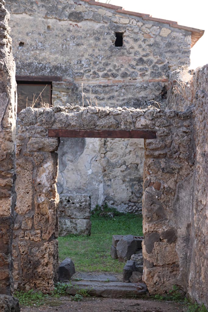 II.1.13 Pompeii. October 2023. 
Looking south through doorway of dining room, photo taken from II.1.1. Photo courtesy of Klaus Heese.