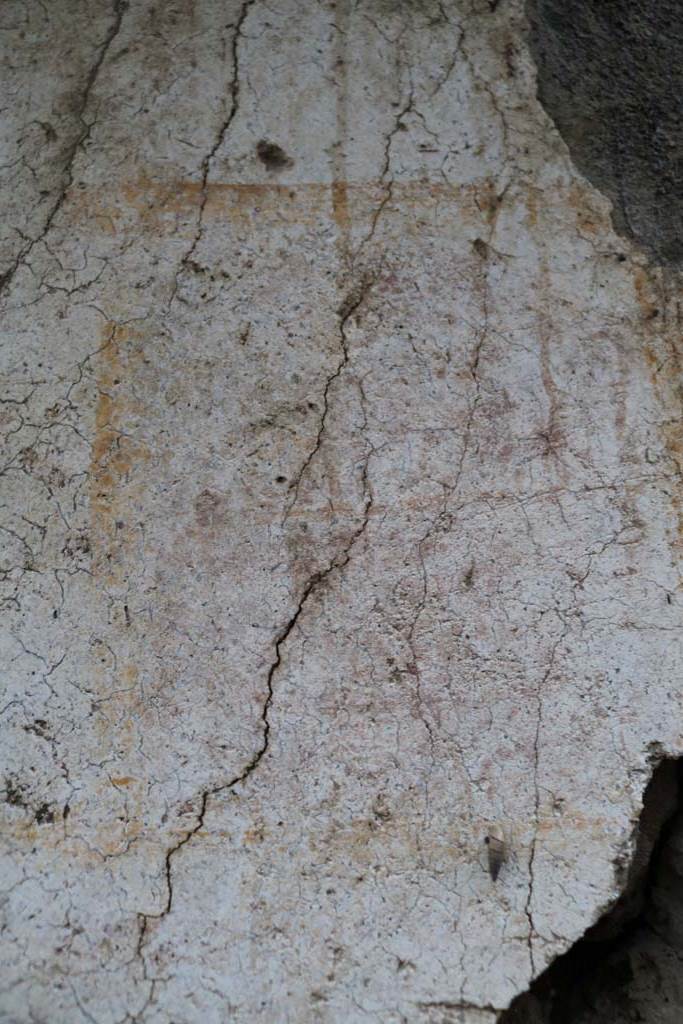 II.1.13 Pompeii. December 2018. 
Detail from painted plaster on exterior wall, on north side (left) of entrance. Photo courtesy of Aude Durand.