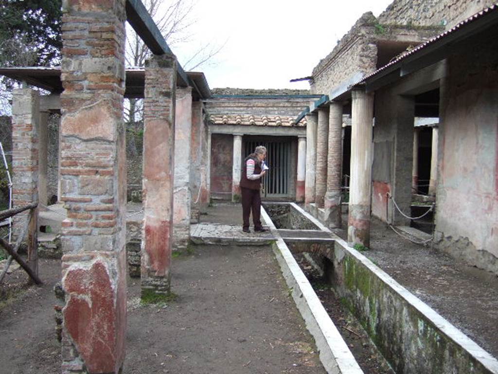 II.2.2 Pompeii. December 2005. Room “i”. Looking west along upper euripus.