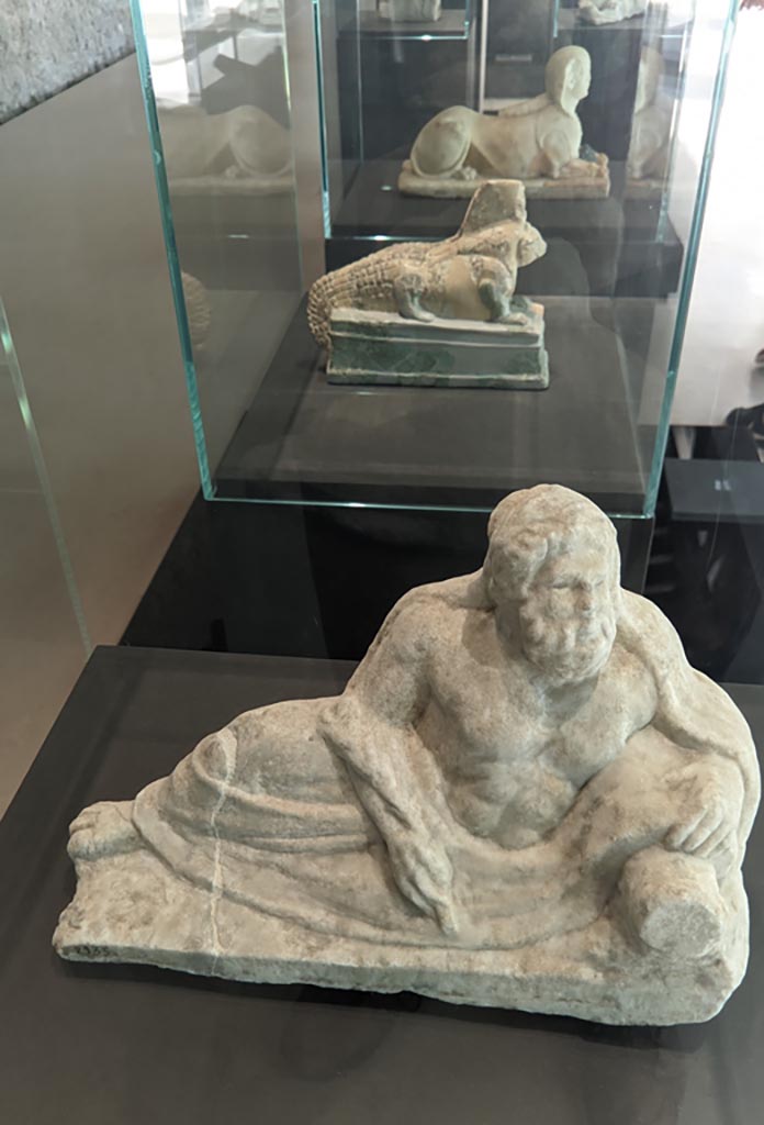 II.2.2 Pompeii. April 2022. 
Room “k”. White marble statuette of a river god. On display in exhibition in Palaestra.
Photo courtesy of Giuseppe Ciaramella.