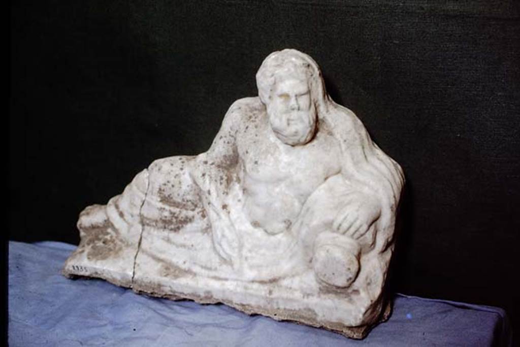 II.2.2. Pompeii. 1978. Room “k”. White marble statuette of a river god. Photo by Stanley A. Jashemski.   
Source: The Wilhelmina and Stanley A. Jashemski archive in the University of Maryland Library, Special Collections (See collection page) and made available under the Creative Commons Attribution-Non Commercial License v.4. See Licence and use details. J78f0169