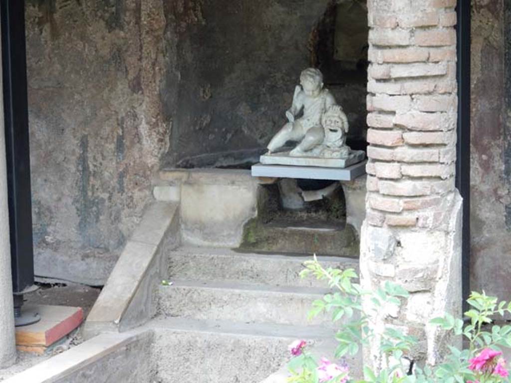 II.2.2 Pompeii. Mary 2016. Room “l”, garden. 
Lower level of nymphaeum with white statuette of a cupid with a mask found above the steps in 1920.
Photo courtesy of Buzz Ferebee.