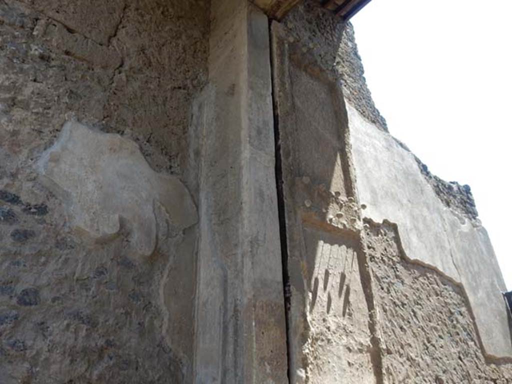 II.2.2 Pompeii. May 2016. East side of entrance doorway, with plaster cast of the shutters of the entrance doorway. 
Photo courtesy of Buzz Ferebee.