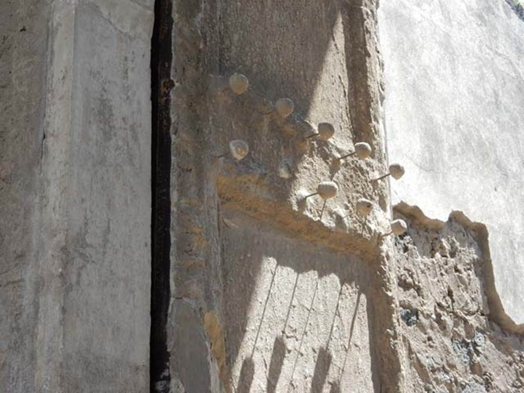 II.2.2 Pompeii. May 2016. Detail from plaster cast of doorway shutter on east side. 
The shutter was decorated with protruding studs of bronze and iron. Photo courtesy of Buzz Ferebee.