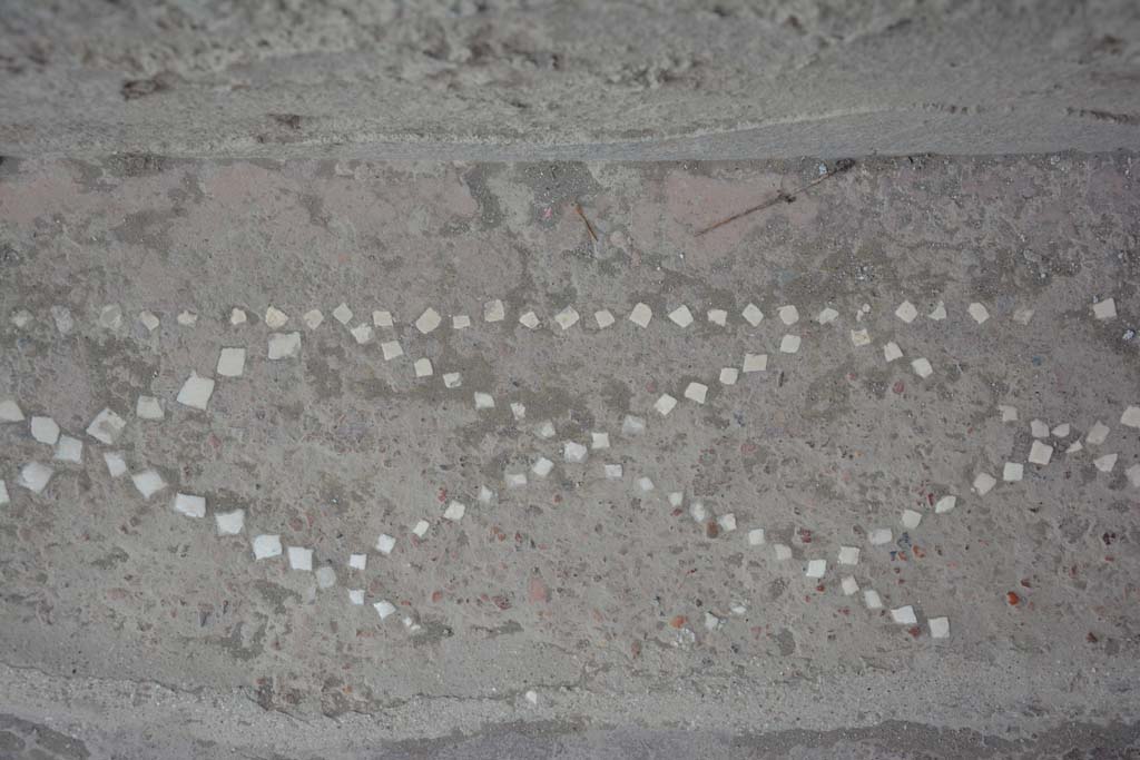 II.2.2 Pompeii. July 2017. Entrance corridor/fauces 1, detail of remains of pattern showing “net” design in small white stones. 
Foto Annette Haug, ERC Grant 681269 DÉCOR.
