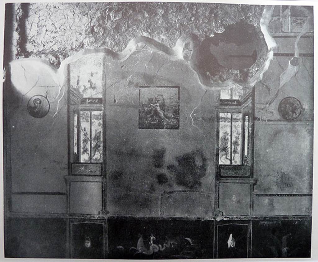 II.2.2 Pompeii. Old photograph of south wall of room “a” cubiculum.
The south wall showed a central painting of Europa and the Bull, with two medallions and imitation painted windows, prior to the 1943 bombing.
The zoccolo/dado was painted black and the middle zone of the walls would have been yellow.