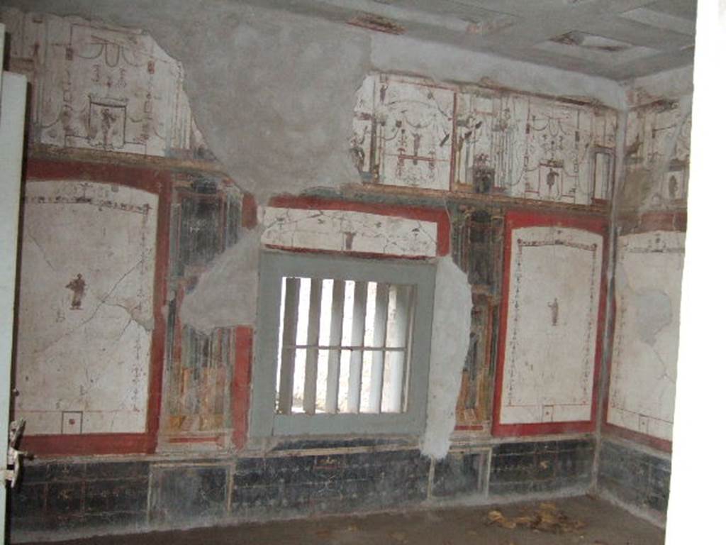 II.2.2 Pompeii. December 2005. Room “f”, south wall of oecus. The painting of the priest of Isis was found on the west side of the south wall. Underneath it was written the inscription AMISUSIUS LoreiUS TIBURTinus. According to Warscher (1930) it was supposed that he was the owner of the house. See Warscher, T., 1930. Pompeii in three hours. Rome, (p.134)  According to Varone and Stefani, under the figure was CIL IV 7534, which is no longer readable. See Varone, A. and Stefani, G., 2009. Titulorum Pictorum Pompeianorum, Rome: L’erma di Bretschneider, (p.198 with photo)