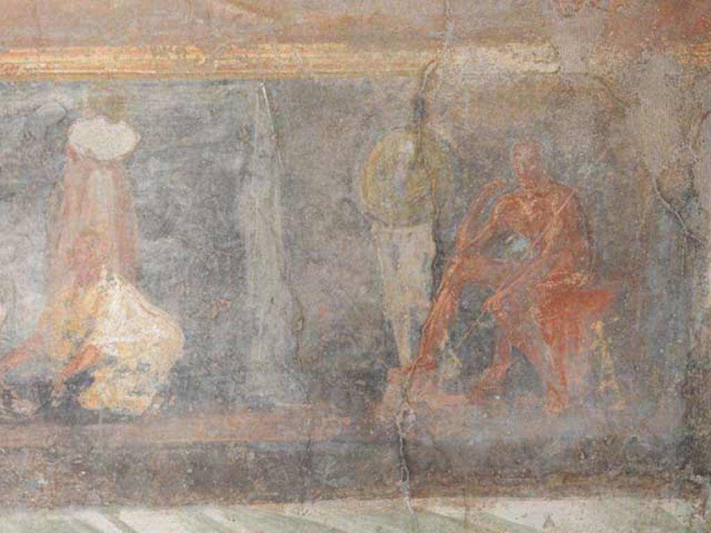 II.2.2 Pompeii. May 2016. Room “h”, south end of east wall. 
In his tent a naked Achilles sits in thoughtful pose, sceptre in his left hand and his sword leaning against his seat. Patroclus, fully armed, is next to him.
See Lorenz K., 2013. In Epic Visions: Visuality in Greek and Latin Epic and its Reception. Cambridge U.P., p. 235-6.
Photo courtesy of Buzz Ferebee.