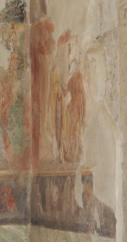 II.2.2 Pompeii. May 2016. Room “h”, south wall in south-east corner.
Large frieze depicting Heracles seated on a rock and placing a Phrygian cap on the head of the young Priam, investing him as the new King of Troy. 
Priam holds a sceptre in his left hand.
Photo courtesy of Buzz Ferebee.
