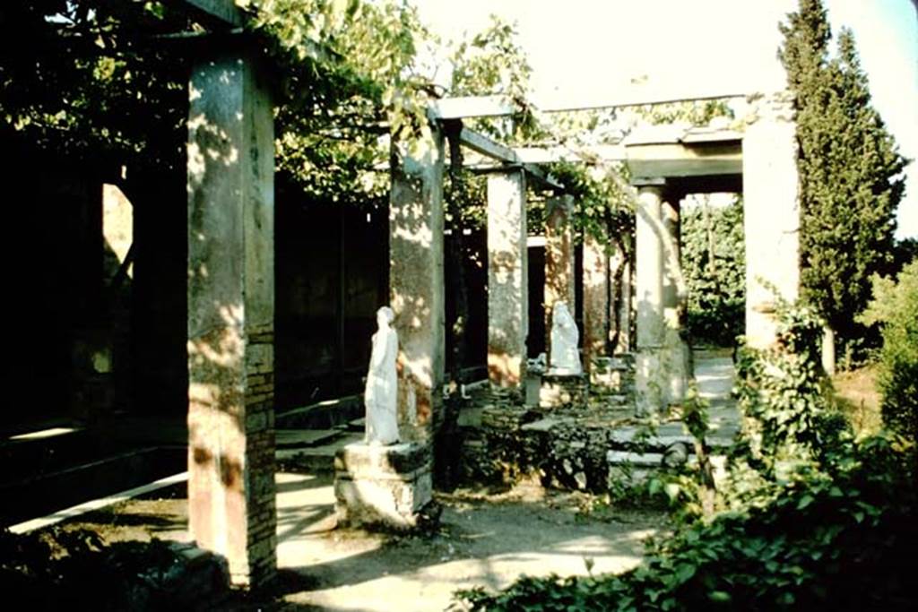 II.2.2 Pompeii. 1957. Room "i", looking east across upper garden area. Jashemski describes the two surviving statues as, one of Polyhymnia (SAP 2917) and the second of Mnemosyne (SAP 2909).
The names on her photographs however are reversed. 
See Jashemski, W. F., 1993. The Gardens of Pompeii, Volume II: Appendices. New York: Caratzas. (p. 80-1, Figs 84-85).
 Photo by Stanley A. Jashemski.
Source: The Wilhelmina and Stanley A. Jashemski archive in the University of Maryland Library, Special Collections (See collection page) and made available under the Creative Commons Attribution-Non Commercial License v.4. See Licence and use details.
J57f0472