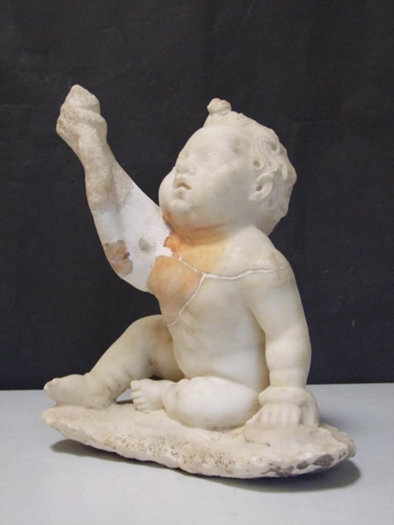 II.2.2 Pompeii. March 2009.  White marble statuette of a young Hercules strangling a snake.  Found on the north side of the upper euripus in the garden in 1920.  SAP inventory number: 2932.