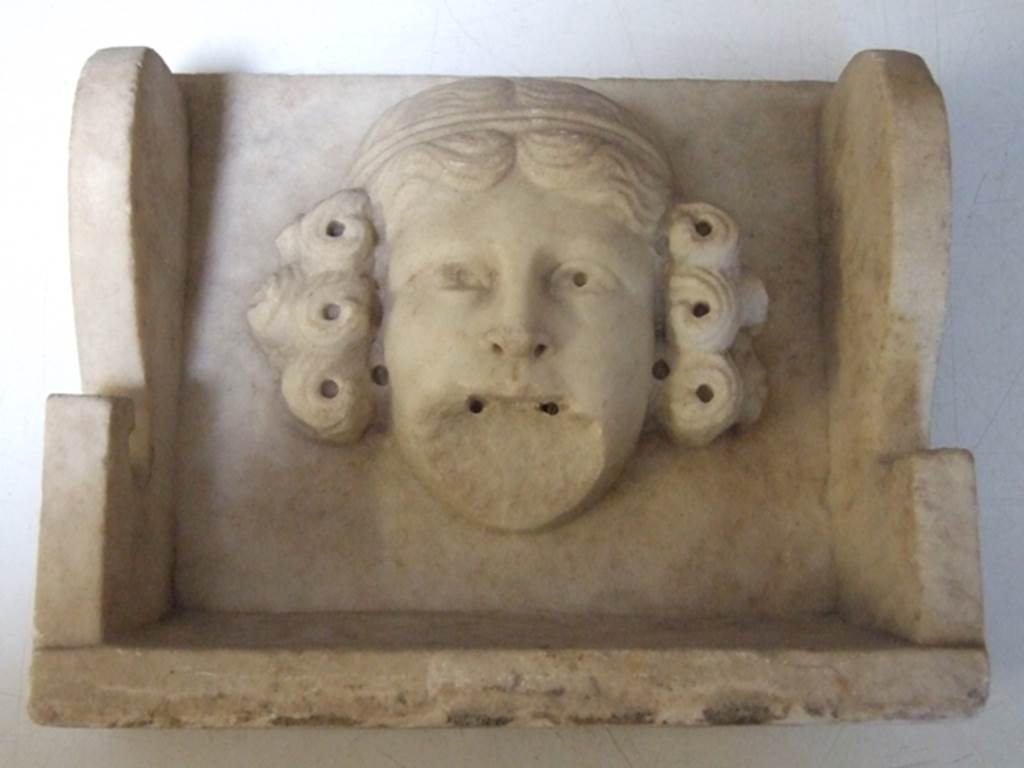 II.2.2 Pompeii. March 2009. Room “i”. White marble Mask of a woman.  Found on the south side of the upper euripus in the garden in 1920.  SAP inventory number: 2928.