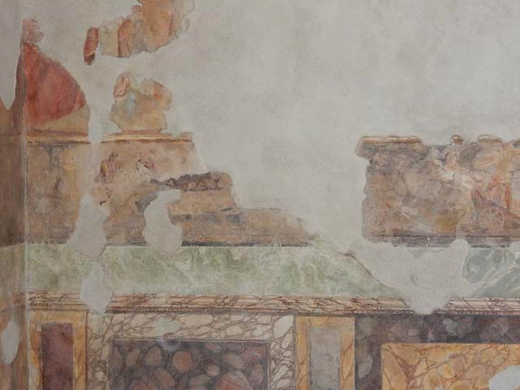 II.2.2 Pompeii. May 2016. Room “h”, west end of north wall. 
Iliad frieze, possibly the Body of Sarpedon, above the marbled zoccolo. 
Photo courtesy of Buzz Ferebee.