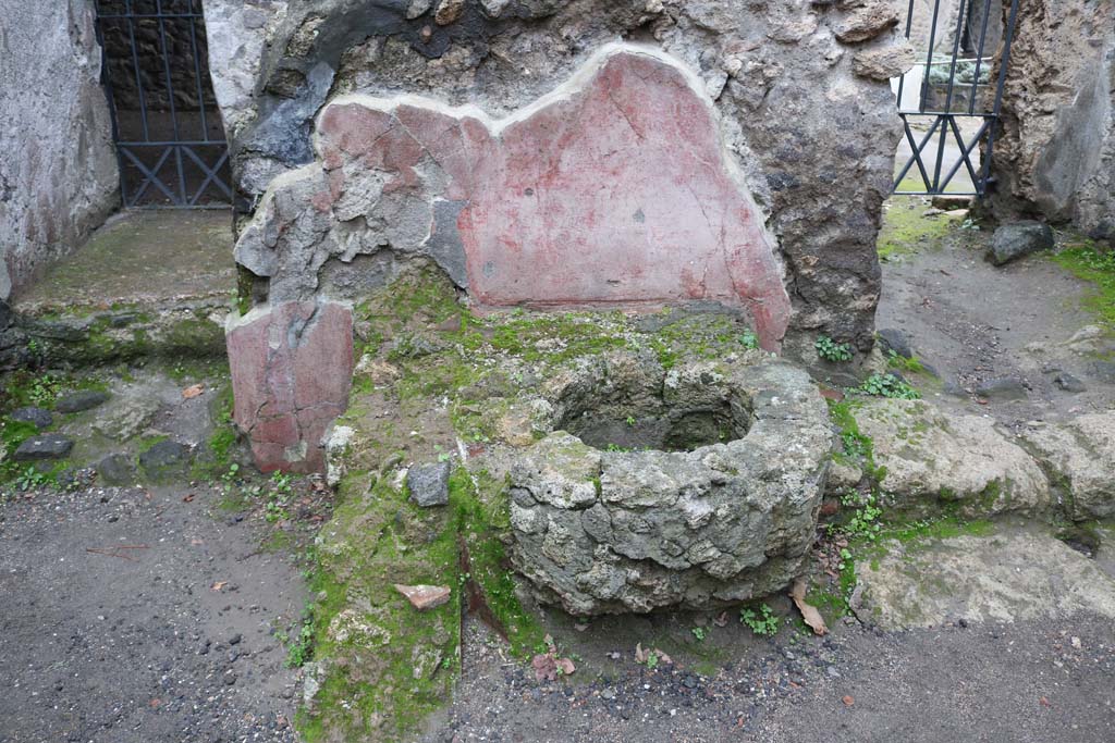 II.2.3 Pompeii. December 2018. 
Looking towards south wall and cistern mouth under the stairs to the upper floor. Photo courtesy of Aude Durand