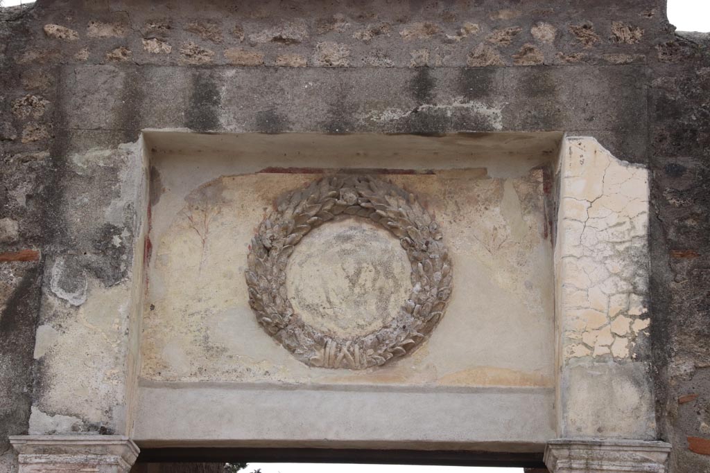 II.2.4 Pompeii. May 2024. Emblem above entrance doorway. Photo courtesy of Klaus Heese.