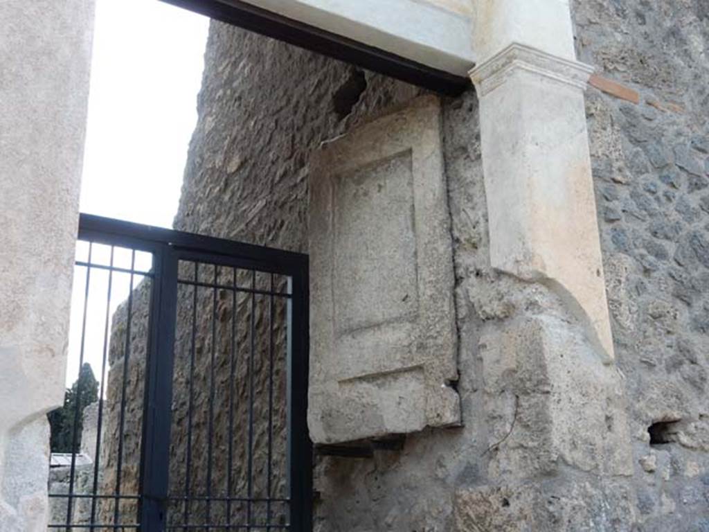 II.2.4 Pompeii. May 2016. Detail of plaster cast of remaining doorway on west side of entrance. Photo courtesy of Buzz Ferebee.