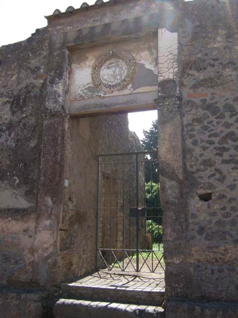 II.2.4 Pompeii. September 2005. Doorway and rooms 1 and 2 leading directly to a portico.
This enclosed the peristyle garden 4 on the north and east sides.
The narrow garden 10 at the rear of the house was entered directly from the east portico.
When excavated this site was found to be badly destroyed, apparently by early explorers.
See Jashemski, W. F., 1993. The Gardens of Pompeii, Volume II: Appendices. New York: Caratzas. (p.83)