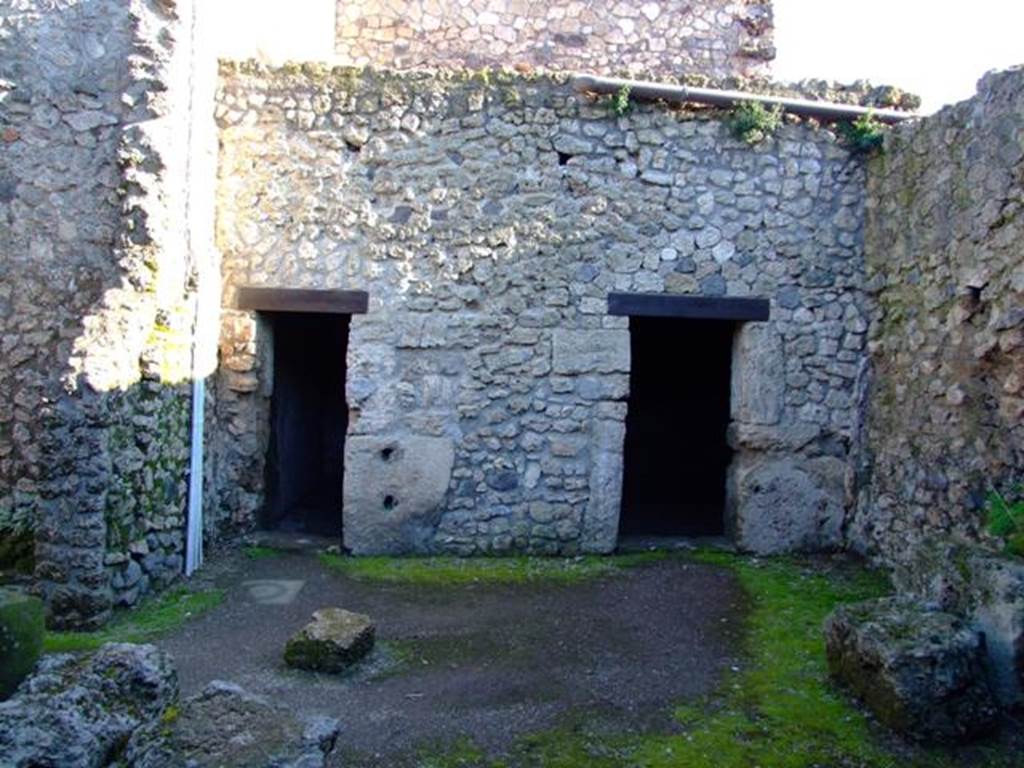 II.3.2 Pompeii. March 2009. South wall of Yard on west of workshop, with doorways to two rooms.