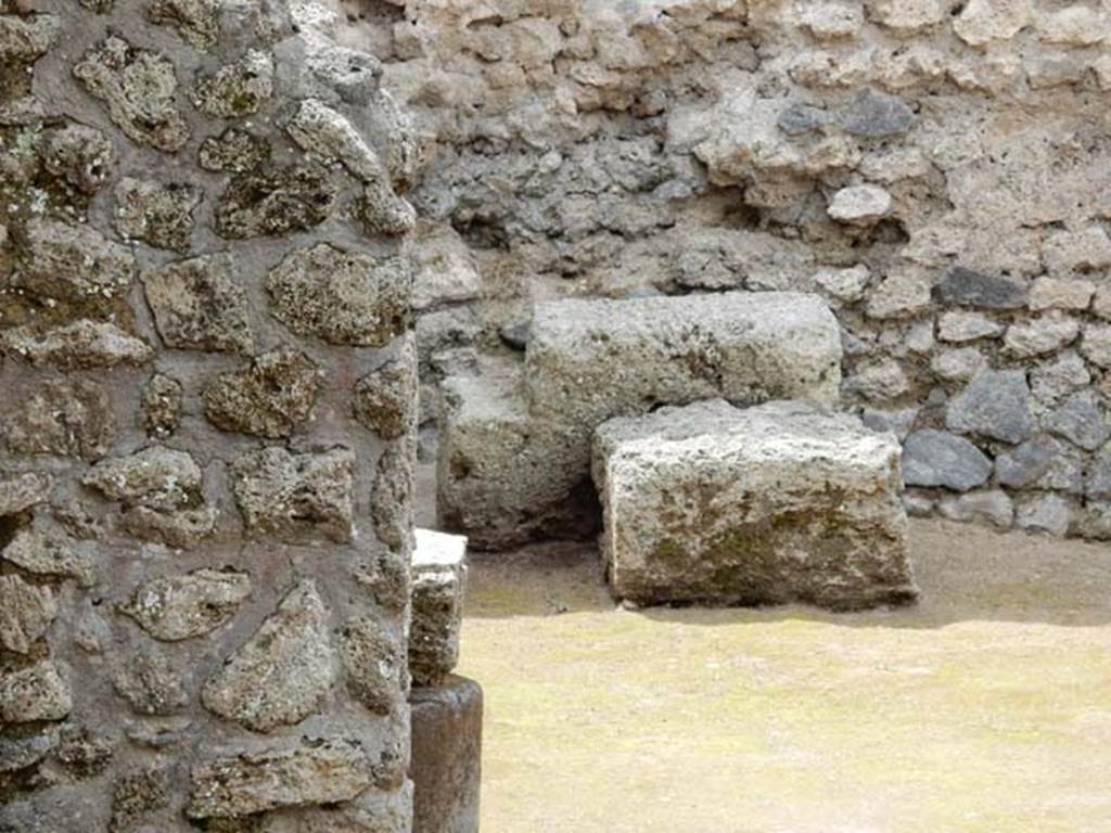 II.3.2 Pompeii. May 2016. Looking towards detail of west wall of yard on west of workshop. Photo courtesy of Buzz Ferebee.