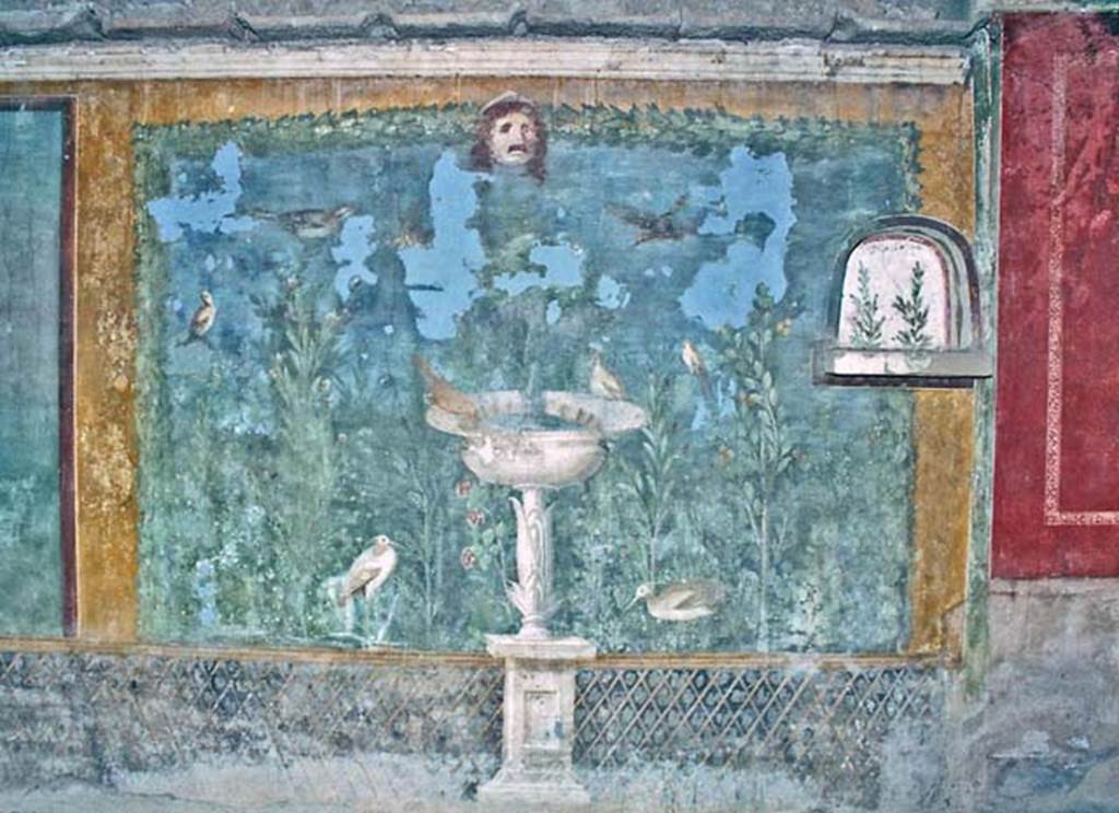 II.3.3 Pompeii. October 2001. Room 11, west panel of south wall of peristyle. 
Wall painting of fountain with garden, mask and birds. Photo courtesy of Peter Woods.