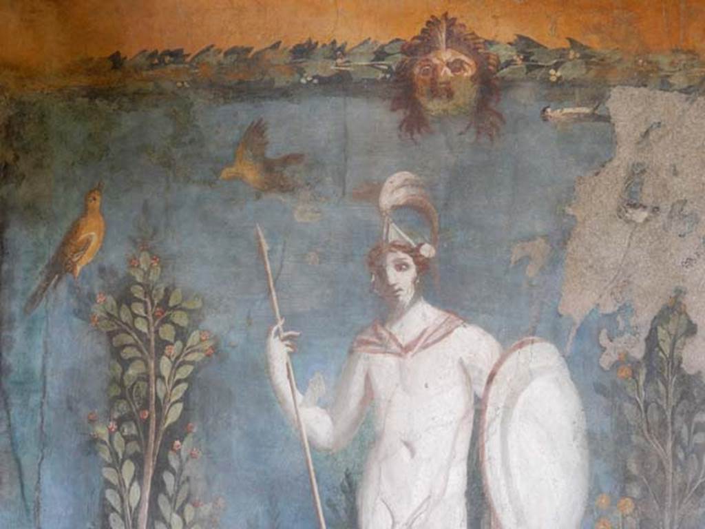 II.3.3 Pompeii. May 2016. Room 11, east panel on south wall of peristyle. 
Detail from wall painting of statue of naked Ares / Mars with a lance and shield, birds and mask. Photo courtesy of Buzz Ferebee.