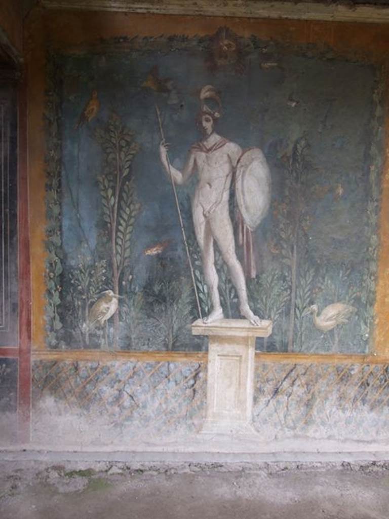 II.3.3 Pompeii. December 2006. Room 11, east panel on south wall of peristyle. Wall painting of statue of naked Ares / Mars with a lance and shield.
