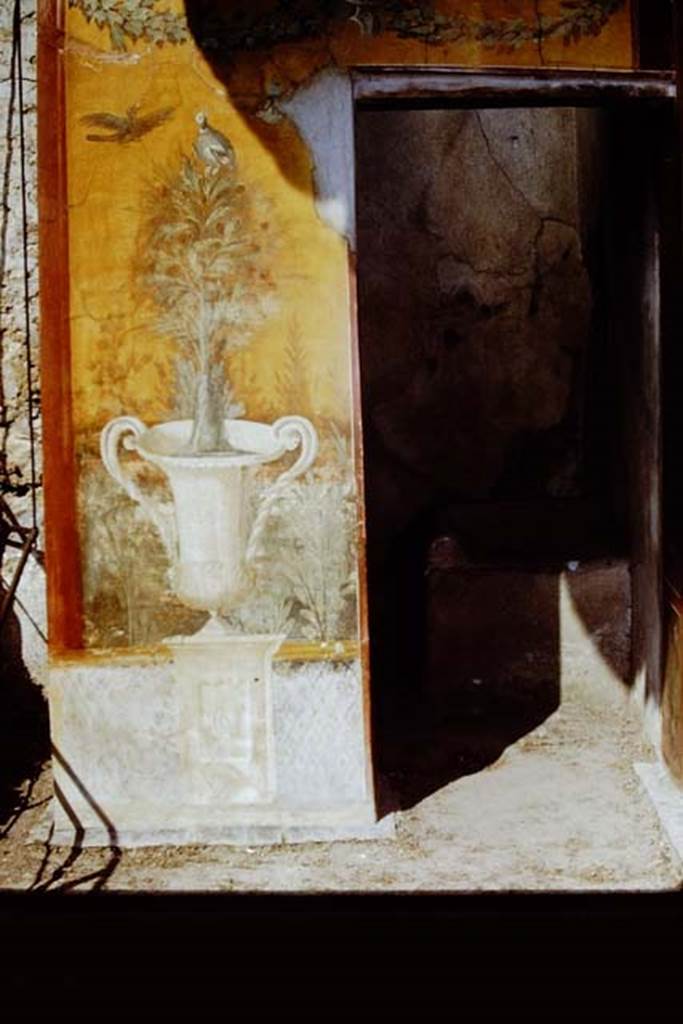 II.3.3 Pompeii. 1971. Room 17, exterior west side of sacellum. Wall painting of crater fountain and tree with birds, and garlands above. Photo by Stanley A. Jashemski.
Source: The Wilhelmina and Stanley A. Jashemski archive in the University of Maryland Library, Special Collections (See collection page) and made available under the Creative Commons Attribution-Non Commercial License v.4. See Licence and use details.
J71f0144