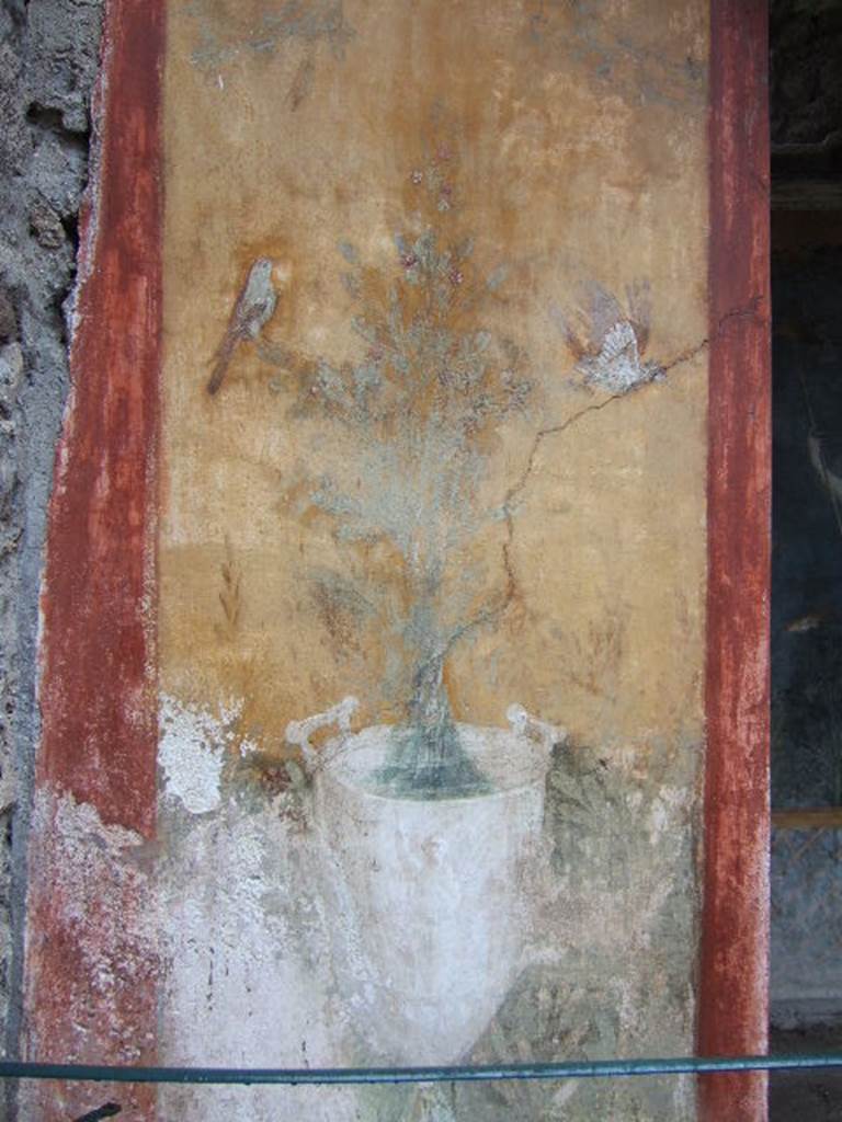 II.3.3 Pompeii. December 2006. Room 17, exterior north side of Sacellum. 
Wall painting of goblet with jet of water and birds.