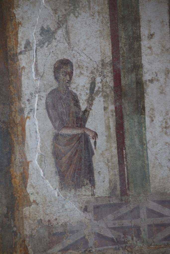 II.3.3 Pompeii. September 2017. Room 9, painted figure on west end of north wall. 
Photo courtesy of Klaus Heese.