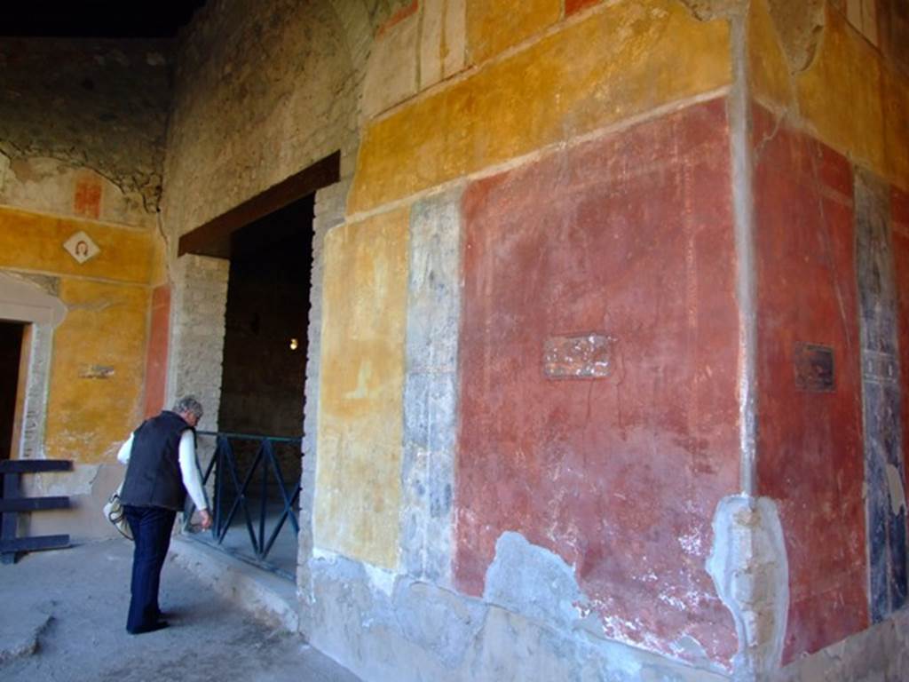 II.3.3 Pompeii. March 2009.  Room 11, west end of north wall of north portico, and doorway to room 5.