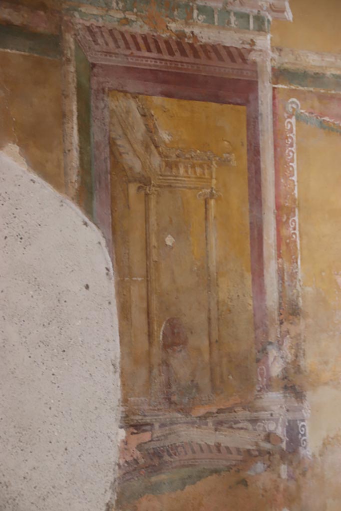 II.3.3 Pompeii. May 2024.  
Room 12, south wall, detail of painted panel on east side of central painting. Photo courtesy of Klaus Heese.