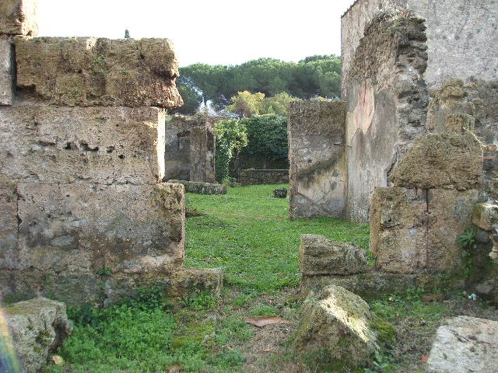 II.3.5 Pompeii. December 2007. South wall of bar-room with doorway to rear room. On the right, would have been the stairs to the upper floor and a hearth. See Van der Poel, H. B., 1986. Corpus Topographicum Pompeianum, Part IIIA. Austin: University of Texas. (p.44)