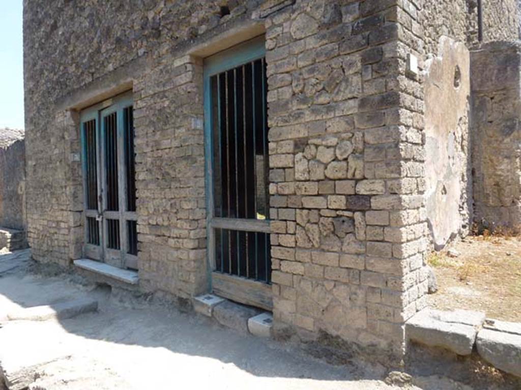 II.4.3 and II.4.2 Pompeii. June 2012. Entrance doorways on south side of Via dell’Abbondanza. Photo courtesy of Michael Binns.