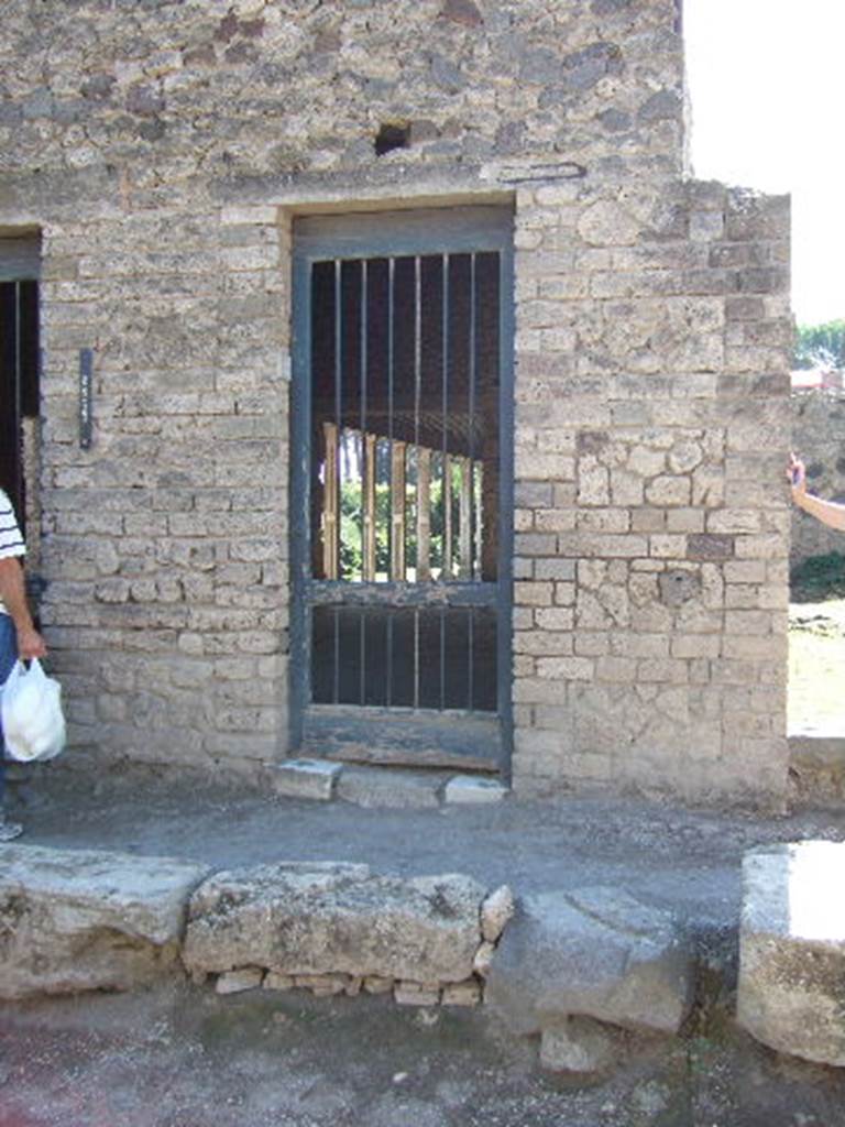 II.4.2 Pompeii. September 2005. Doorway to steps leading to upper floor.  According to Cooley, the graffito CIL IV 1136 was found on the wall here. According to Della Corte, it was found on the west (right) side of II.4.6, so see II.4.6
See Cooley, A. and M.G.L., 2004. Pompeii : A Sourcebook. London : Routledge. (p.171)
See Della Corte, M., 1965.  Case ed Abitanti di Pompei. Napoli: Fausto Fiorentino. (p.390)