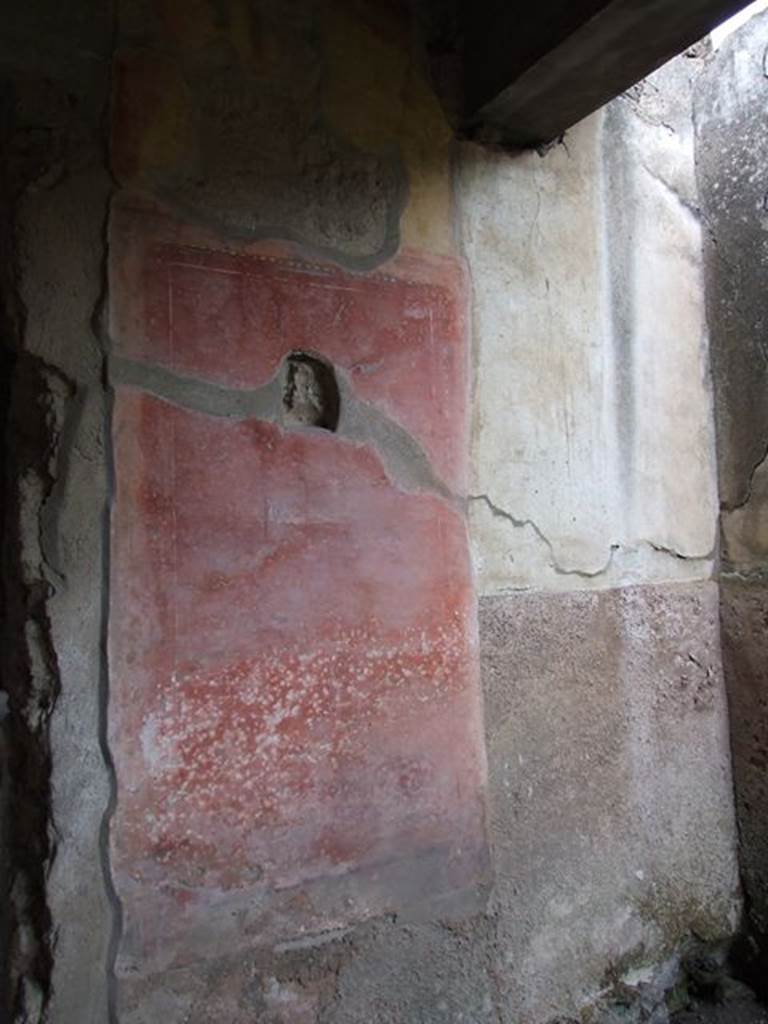II.4.3 Pompeii. December 2006. Remains of painted decoration from north wall of west portico, on east side of doorway to atrium.