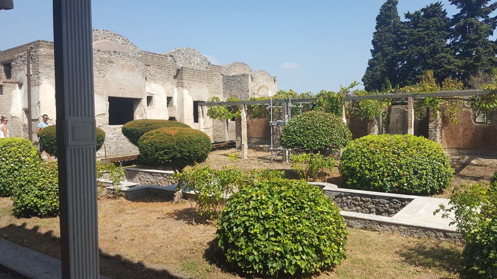 II.4.6 Pompeii. September 2019. Looking north-east across garden area towards south side of baths’ building. 
Photo courtesy of Klaus Heese.