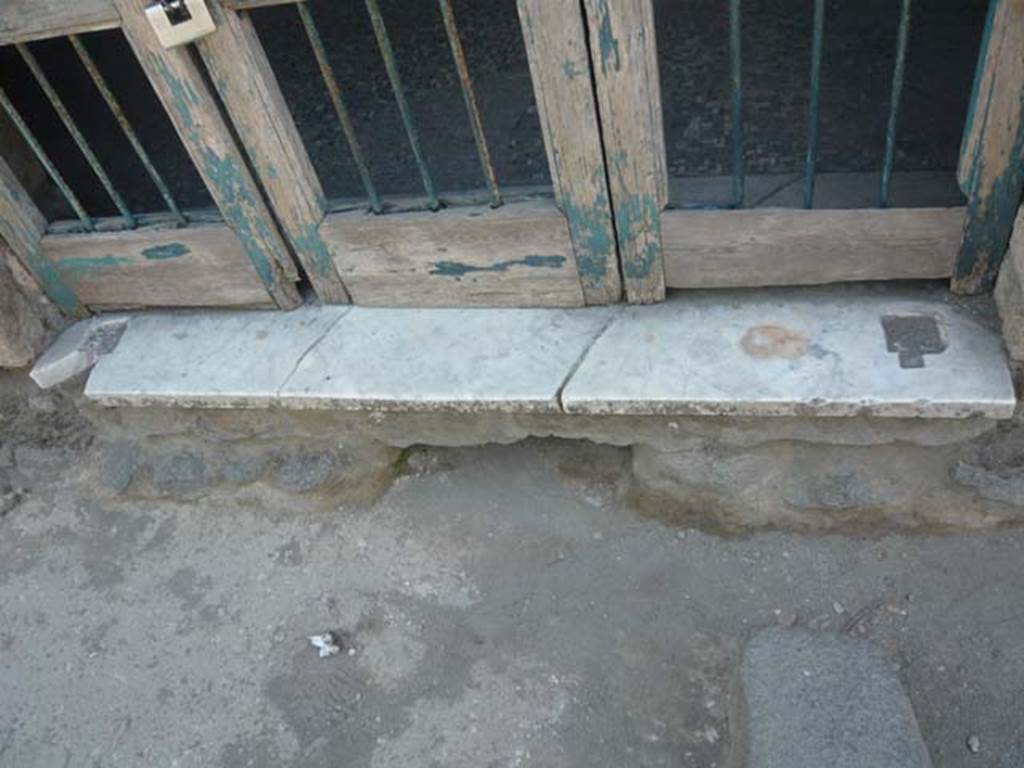 II.4.3 Pompeii. May 2012. Detail of entrance doorway threshold. Photo courtesy of Buzz Ferebee.