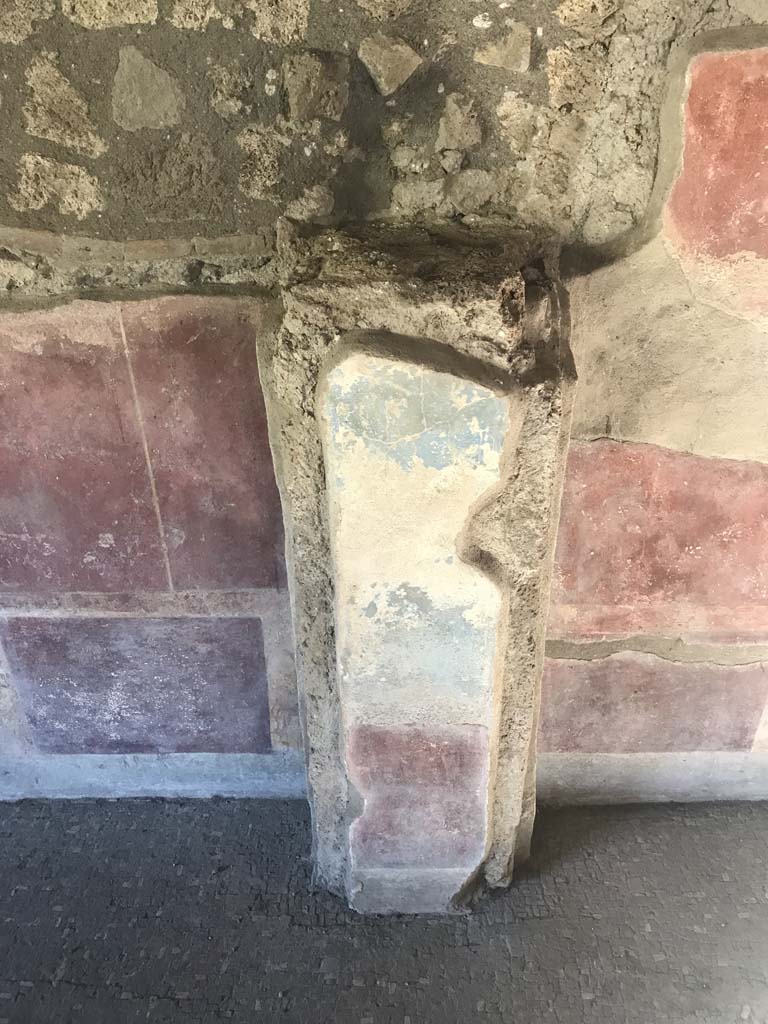 II.4.3 Pompeii. April 2019. Detail of painted decoration on pilaster in east wall of atrium. 
Photo courtesy of Rick Bauer.