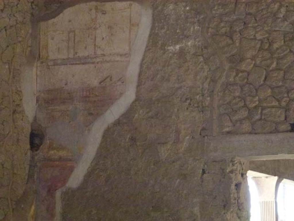 II.4.3 Pompeii. June 2012. Detail of remains of painted plaster in south-east corner of atrium. Photo courtesy of Michael Binns.
