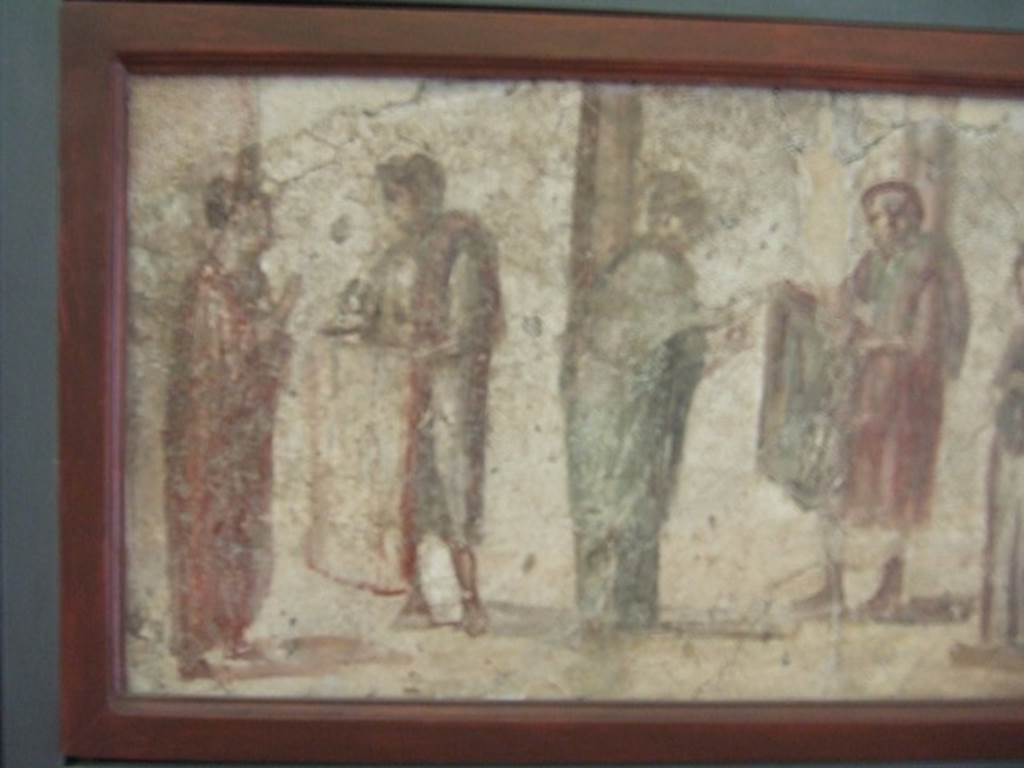 II.4.3 Pompeii.  Close up of part of the “Forum Frieze”.  Sale of clothing.  Found on East wall of the atrium.  Now in Naples Archaeological Museum.  Inventory number 9063.