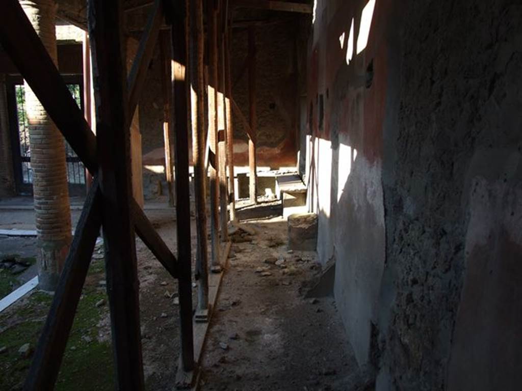 II.4.6 Pompeii. December 2006. Looking north along east wall towards benches and entrance doorway.