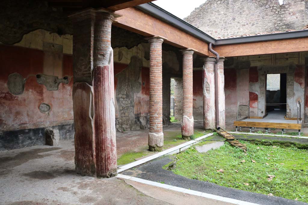 II.4.6 Pompeii. December 2018. 
Looking towards the east side and south-east corner of the portico of the baths, from entrance doorway. Photo courtesy of Aude Durand.