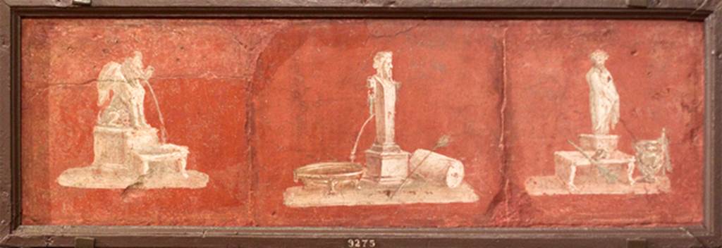 II.4.6 Pompeii. 3 separate frescoes with depiction of architectural fountains, united into one frame.  Now in Naples Archaeological Museum.  Inventory number 9275, described as being from Herculaneum. According to PPM, the separate vignettes of a Sphynx fountain (on left), and statue of a Philosopher (on right) would have been found in this front portico by the Bourbons, detached and sent to the Museum.
The vignette of the Herm used as a fountain, perhaps came from the atrium reached by entrance doorway II.4.10 and II.4.11, and from the south end of the west portico of the garden area.
See Carratelli, G. P., 1990-2003. Pompei: Pitture e Mosaici. Vol. III. Roma: Istituto della enciclopedia italiana. (p.212-3, no.43)