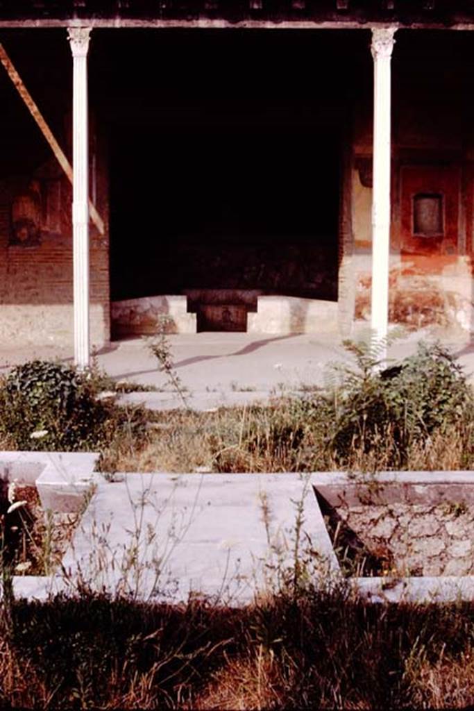 II.4.6 Pompeii. 1977. Looking west from garden water feature towards the entrance to the summer triclinium. Photo by Stanley A. Jashemski.   
Source: The Wilhelmina and Stanley A. Jashemski archive in the University of Maryland Library, Special Collections (See collection page) and made available under the Creative Commons Attribution-Non Commercial License v.4. See Licence and use details. J77f0442