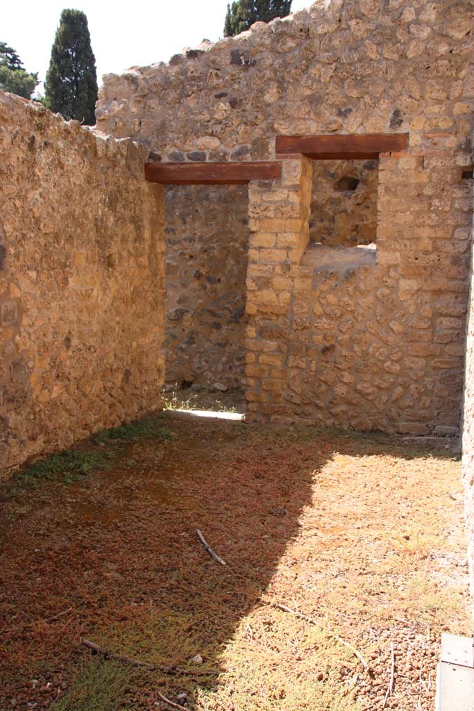 II.4.6 Pompeii. September 2019. 
Looking west into room on south side of previous room, with doorway to rear corridor in its west wall.
Photo courtesy of Klaus Heese.