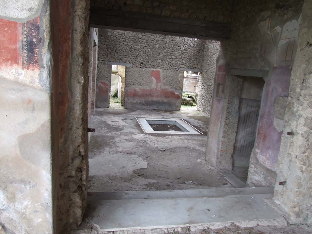 II.4.6 Pompeii. December 2006. Looking south into atrium of II.4.10, from top of steps at south end of portico. 
To view these rooms, see II.4.10.