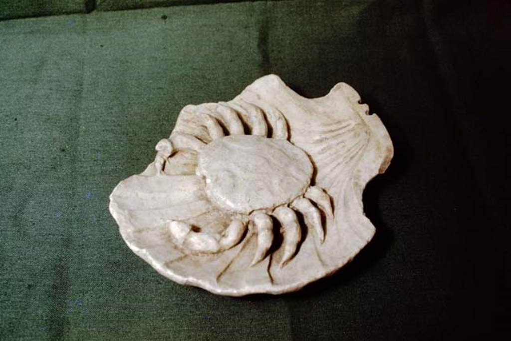 II.4.6 Pompeii, 1978. Small fountain statue of a crab, found in garden. Photo by Stanley A. Jashemski.   
Source: The Wilhelmina and Stanley A. Jashemski archive in the University of Maryland Library, Special Collections (See collection page) and made available under the Creative Commons Attribution-Non Commercial License v.4. See Licence and use details. J78f0098