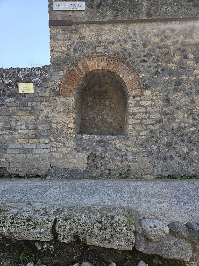 Pompeii II.4.7a. November 2024. Street shrine at east end of II.4. Photo courtesy of Annette Haug.
According to the Insula identification plaque above the street shrine, this Insula was originally known as Reg. II, Insula VII.