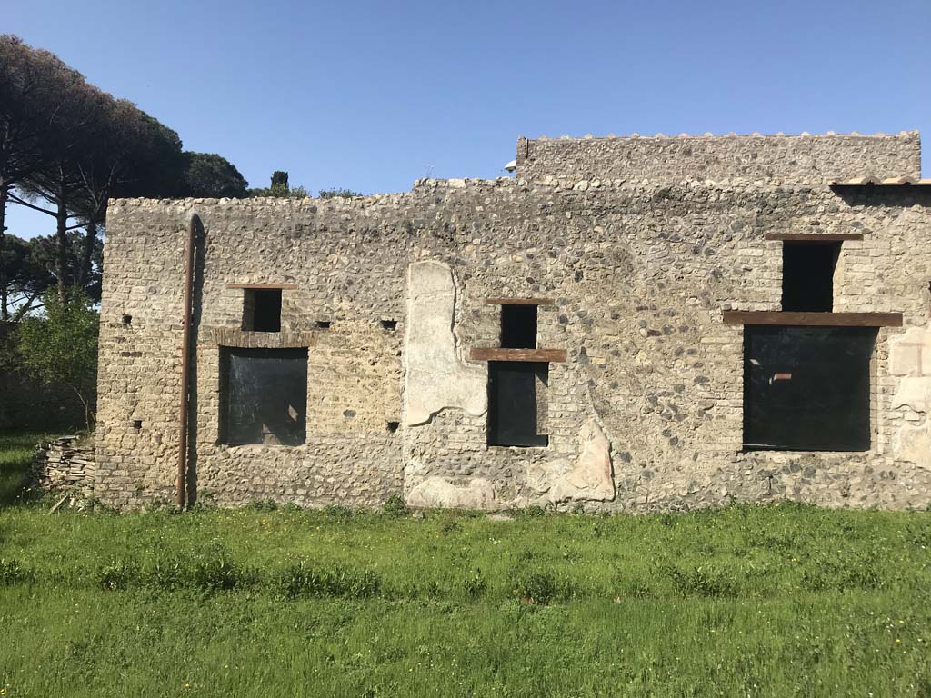 II.4.9 Pompeii. April 2019. Looking towards windows of rooms on west side of garden which can be seen at II.4.10. 
On the left are the windows of two cubicula, and the window of the tablinum is on the right.
Photo courtesy of Rick Bauer.